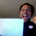 A picture of me giving a 'thumbs up', holding a sign that says "I