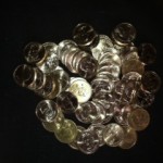 Pile of de-godded dollar coins