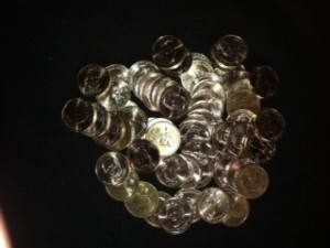 Pile of de-godded dollar coins