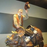 Edwin Attempts to Ride Dino at Creation Museum