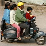 A family rides on scooter in Siliguri