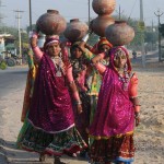 women_carrying_water