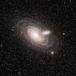 Hubble catches a large and small spiral galaxy similar to the respective dimensions of NGC 1277 and our Milky Way. Which one do you think would have the largest central black-hole?
