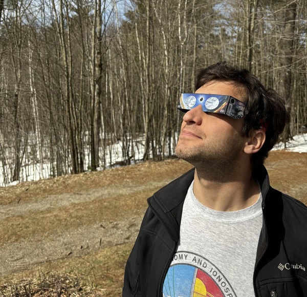 The author, with eclipse glasses on, gazing toward the sky