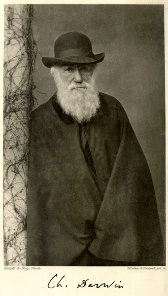 Image shows a white-bearded Darwin wrapped in a black cape, leaning against a vine-twined post.