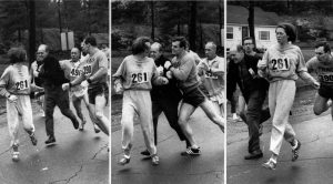 Image courtesy Newsweek. A woman, listed only as K. Switzer of Syracuse, found herself about to be thrown out of the normally all-male Boston Marathon when a husky companion, Thomas Miller of Syracuse, threw a block that tossed a race official out of the running instead, April 19, 1967 in Hopkinton, Mass.(AP PHOTO)